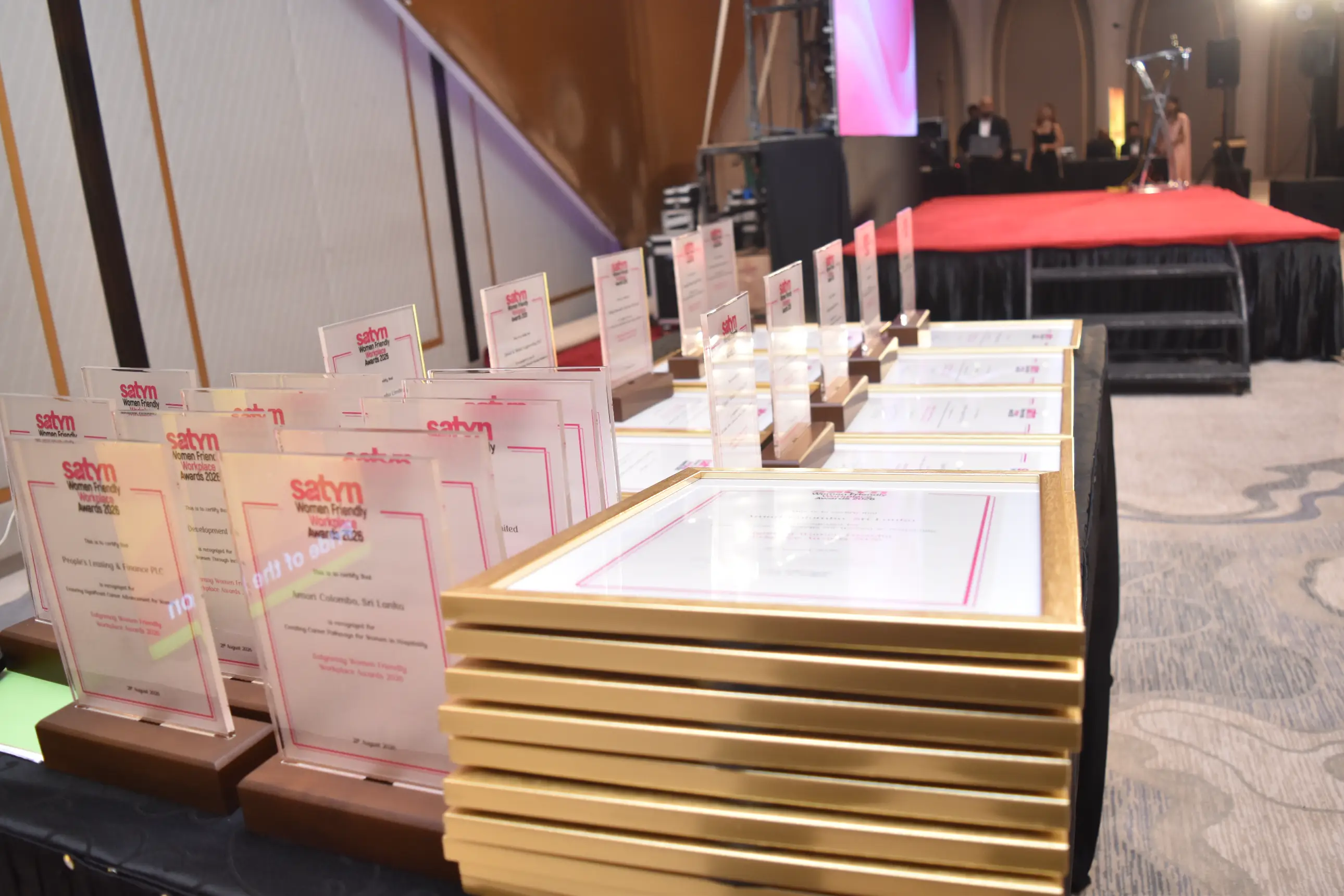 Satynmag Women Friendly Workplace Awards trophies on display.